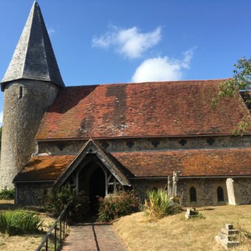 Colour photographs of one of three Sussex round tower churches